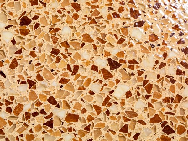 Close-up of the Sandstone flake blend: Tan, cream, umber.